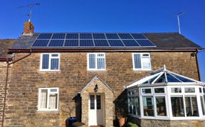 Solar panels on cottage style house