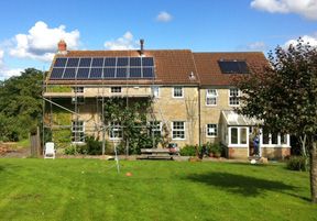 Solar panels on house with lawn