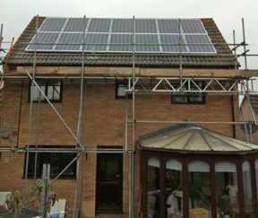 Solar panels on house with grey front