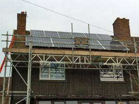 Solar panels on house with grey front